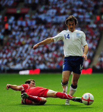 LONDON, ENGLAND - JUNE 04:  Stephan Lichtsteiner of Switzerland (L) tackles Leighton Baines of England during the UEFA EURO 2012 group G qualifying match between England and Switzerland at Wembley Stadium on June 4, 2011 in London, England.  (Photo by Jam