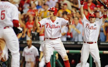 PHILADELPHIA , PA - AUGUST 17:  Hunter Pence #3 of the Philadelphia Phillies signals John Mayberry Jr.#15 to slide for the 4th run of the game against the Arizona Diamondbacks at Citizens Bank Park on August 17, 2011 in Philadelphia, Pennsylvania. The Phi