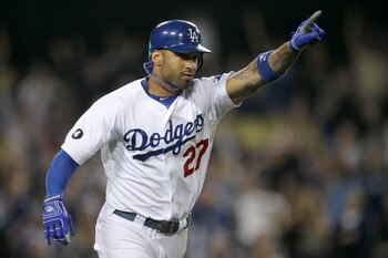 LOS ANGELES, CA - AUGUST 12: Matt Kemp #27 celebrates as he runs to first on his walk off RBI single in the tenth inning against the Los Angeles Dodgers the Houston Astros on August 12, 2011 at Dodger Stadium in Los Angeles, California.  (Photo by Stephen