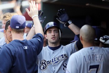 NEW YORK, NY - AUGUST 21:  Ryan Braun #8 of the Milwaukee Brewers celebrates in the dugout after scoring an eighth inning run against the New York Mets at Citi Field on August 21, 2011 in the Flushing neighborhood of the Queens borough of New York City. T