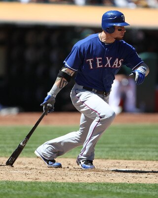 OAKLAND, CA - AUGUST 13:  Josh Hamilton #32 of the Texas Rangers singles in the seventh inning against the Oakland Athletics at O.co Coliseum on August 13, 2011 in Oakland, California.  (Photo by Jed Jacobsohn/Getty Images)