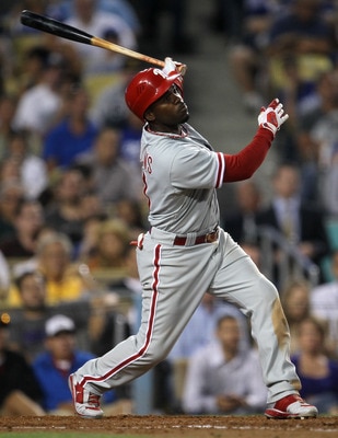 LOS ANGELES, CA - AUGUST 09:  Jimmy Rollins #11 of the Philadelphia Phillies hits an RBI double in the third inning against the Los Angeles Dodgers on August 9, 2011 at Dodger Stadium in Los Angeles, California.  (Photo by Stephen Dunn/Getty Images)