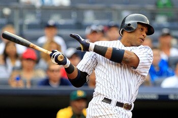 NEW YORK, NY - AUGUST 25:  Robinson Cano #24  of the New York Yankees hits a grand slam home run in the 5th inning against the Oakland Athletics on August 25, 2011 at Yankee Stadium in the Bronx borough of New York City.  (Photo by Chris Trotman/Getty Ima