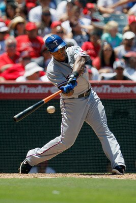 ANAHEIM, CA - JULY 21:  Adrian Beltre #29 of the Texas Rangers hits a double against the Los Angeles Angels of Anaheim in the sixth inning at Angel Stadium of Anaheim on July 21, 2011 in Anaheim, California. The Angels defeated the Rangers 1-0.  (Photo by