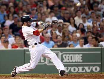 BOSTON, MA - JULY 07:  Dustin Pedroia #15 of the Boston Red Sox hits a three run homer against the Baltimore Orioles in the third inning on July 7, 2011 at Fenway Park in Boston, Massachusetts.  (Photo by Elsa/Getty Images)