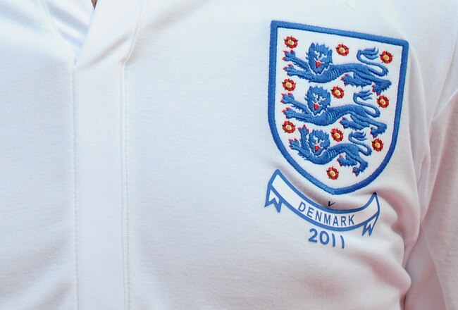 COPENHAGEN, DENMARK - FEBRUARY 09:  Wayne Rooney of England stands for the national anthems prior to the International Friendly match between Denmark and England at Parken Stadium on February 9, 2011 in Copenhagen, Denmark.  (Photo by Mike Hewitt/Getty Im
