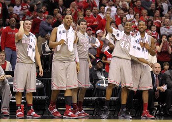 CLEVELAND, OH - MARCH 20:  Aaron Craft #4, Jared Sullinger #0, Jon Diebler #33, William Buford #44 and David Lighty #23 of the Ohio State Buckeyes look on from the bench late in the second half against the George Mason Patriots during the third of the 201