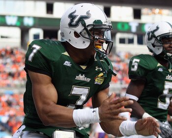 CHARLOTTE, NC - DECEMBER 31:  B.J. Daniels #7 of the USF Bulls celebrates after scoring a touchdown against the Clemson Tigers during their game at Bank of America Stadium on December 31, 2010 in Charlotte, North Carolina.  (Photo by Streeter Lecka/Getty