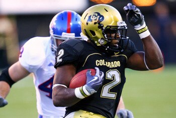 BOULDER, CO - OCTOBER 17: Darrell Scott #2 of the Colorado Buffaloes runs away from Darrell Stuckey #25 of the Kansas Jayhawks during the game at Folsom Field on October 17, 2009 in Boulder, Colorado. (Photo by Garrett W. Ellwood/Getty Images)
