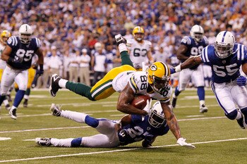 INDIANAPOLIS, IN - AUGUST 26: Jermichael Finley #88 of the Green Bay Packers dives for a first down during the first half of an NFL preseason game against the Indianapolis Colts at Lucas Oil Stadium on August 26, 2011 in Indianapolis, Indiana. (Photo by J