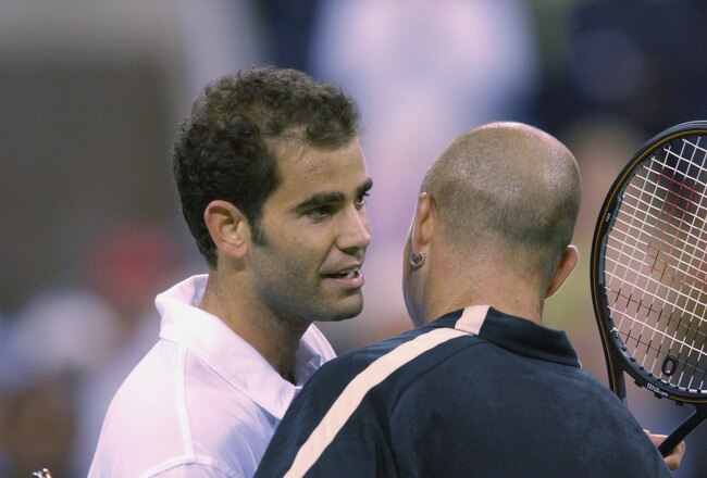FLUSHING-SEPTEMBER 5: Pete Sampras of the USA shakes hands with Andre Agassi of the USA after their match at the US Open at the USTA National Tennis Center on September 5, 2001 in Flushing Meadows Corona Park in Flushing, New York.(Photo by Clive Brunskil