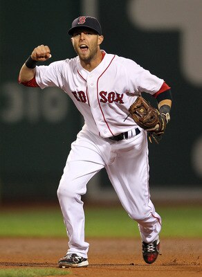 BOSTON - AUGUST 16:  Dustin Pedroia #15 of the Boston Red Sox reacts after the Red Sox turn a triple play against the Tampa Bay Rays in the third inning in the second game of a doubleheader at Fenway Park on August 16, 2011 in Boston, Massachusetts.  (Pho