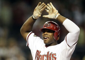 PHOENIX, AZ - AUGUST 30:  Justin Upton #10 of the Arizona Diamondbacks celebrates after hitting a two run home against the Colorado Rockies during the eighth inning of the Major League Baseball game at Chase Field on August 30, 2011 in Phoenix, Arizona.