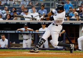 NEW YORK, NY - AUGUST 10:  Curtis Granderson #14 of the New York Yankees hits a three run homerun in the bottom of the first inning against the Los Angeles Angels of Anaheim on August 10, 2011 at Yankee Stadium in the Bronx borough of New York City.  (Pho