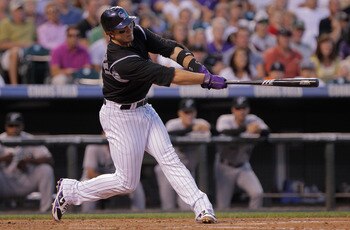 DENVER, CO - AUGUST 15:  Troy Tulowitzki #2 of the Colorado Rockies hits a two run homerun off of starting pitcher Clay Hensley #32 of the Florida Marlins in the third inning at Coors Field on August 15, 2011 in Denver, Colorado.  (Photo by Doug Pensinger