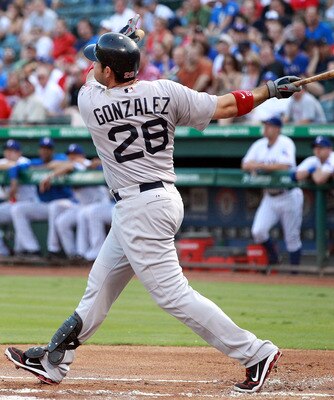 ARLINGTON, TX - AUGUST 23:  Adrian Gonzalez #28 of the Boston Red Sox hits a two-run home run against the Texas Rangers  at Rangers Ballpark in Arlington on August 23, 2011 in Arlington, Texas.  (Photo by Ronald Martinez/Getty Images)