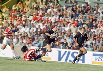 Marc Ellis on his way to scoring one of his six tries.