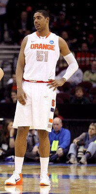 CLEVELAND, OH - MARCH 18: Dion Waiters #3, Brandon Triche #20 and Fab Melo #51 of the Syracuse Orange look on late in the game against the Indiana State Sycamores during the second round of the 2011 NCAA men's basketball tournament at Quicken Loans Arena