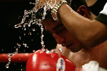 LAS VEGAS - MARCH 19:  Erik Morales of Mexico is worked on in his corner during the World Super Featherweight Championship at the MGM Grand Hotel on March 19, 2005 in Las Vegas, Nevada.  Morales won 15-13 over Manny Pacquiao of the Philippines by unanimou