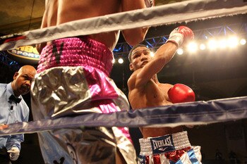 ATLANTIC CITY, NJ - MARCH 26: Yuriorkis Gamboa punches Jorge Solis during their IBF WBA World Featherweight title bout during Top Rank's 'Featherweight Fury' on March 26, 2011 at Boardwalk Hall in Atlantic City, New Jersey. (Photo by Hunter Martin/Getty I