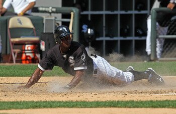 CHICAGO, IL - AUGUST 31: Juan Pierre #1 of the Chicago White Sox slides across home plate to score a run against the Minnesota Twins at U.S. Cellular Field on August 31, 2011 in Chicago, Illinois. The Twins defeated the White Sox 7-6. (Photo by Jonathan D