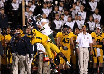 BERKELEY, CA - NOVEMBER 13:  Jeff Maehl #23 of the Oregon Ducks jumps over Steve Williams #1 of the California Golden Bears to catch the ball in front of the Cal sideline at California Memorial Stadium on November 13, 2010 in Berkeley, California. The cat