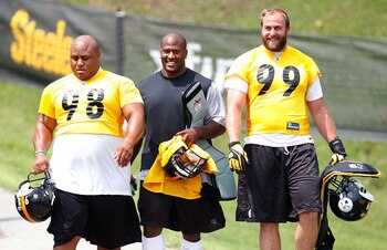 LATROBE, PA - JULY 29: Casey Hampton #98, James Harrison #92, and Brett Keisel #99 of the Pittsburgh Steelers walk down to the field during training camp on July 29, 2011 at St Vincent College in Latrobe, Pennsylvania.  (Photo by Jared Wickerham/Getty Ima