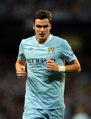 MANCHESTER, ENGLAND - AUGUST 15:  Adam Johnson of Manchester City looks on during the Barclays Premier League match between Manchester City and Swansea City at Etihad Stadium on August 15, 2011 in Manchester, England.  (Photo by Chris Brunskill/Getty Imag