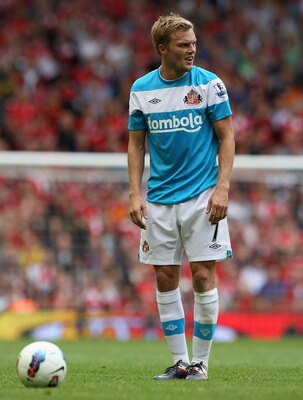 LIVERPOOL, ENGLAND - AUGUST 13:  Sebastian Larsson of Sunderland prepares to take a free kick during the Barclays Premier League match between Liverpool and Sunderland at Anfield on August 13, 2011 in Liverpool, England.  (Photo by Clive Brunskill/Getty I