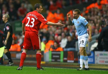 LIVERPOOL, ENGLAND - NOVEMBER 21:  Craig Bellamy of Manchester City rejects the hand of Jamie Carragher of Liverpool during the Barclays Premier League match between Liverpool and Manchester City at Anfield on November 21, 2009 in Liverpool, England.  (Ph