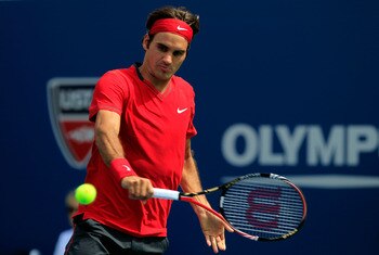 NEW YORK, NY - SEPTEMBER 01:  Roger Federer of Switzerland returns a shot against Dudi Sela of Israel during Day Four of the 2011 US Open at the USTA Billie Jean King National Tennis Center on September 1, 2011 in the Flushing neighborhood of the Queens b