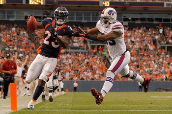 DENVER, CO - AUGUST 20:  Running back Willis McGahee #23 of the Denver Broncos beats linebacker Reggie Torbor #53 of the Buffalo Bills to the end zone for a touchdown in the second quarter at Sports Authority Field at Mile High on August 20, 2011 in Denve