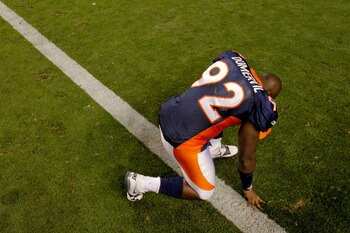 DENVER, CO - AUGUST 20:  Defensive end Elvis Dumervil #92 of the Denver Broncos pauses to pray after a game against the Buffalo Bills at Sports Authority Field at Mile High on August 20, 2011 in Denver, Colorado. The Broncos defeated the Bills 24-10. (Pho
