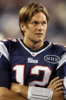 FOXBORO, MA - SEPTEMBER 01:  Tom Brady #12 of the New England Patriots looks on from the sideline in the second half against the New York Giants on September 1, 2011 at Gillette Stadium in Foxboro, Massachusetts.  (Photo by Elsa/Getty Images)