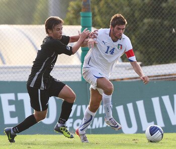 ROME, ITALY - SEPTEMBER 03:  Davide Santon (R) of Italy competes for the ball with Renan of Botafogo FR during the International Friendly match between Italy U21 and Botafogo FR at Sport Center La Borghesiana on September 3, 2011 in Rome, Italy.  (Photo b
