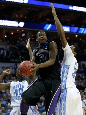 CHARLOTTE, NC - MARCH 20:  Terrence Ross #31 of the Washington Huskies shoots over John Henson #31 of the North Carolina Tar Heels in the first half during the third round of the 2011 NCAA men's basketball tournament at Time Warner Cable Arena on March 20