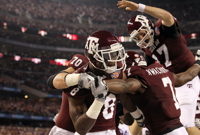 ARLINGTON, TX - JANUARY 07:  Wide receiver Jeff Fuller #8 and Uzoma Nwachukwu #7 of the Texas A&M Aggies celebrate a touchdown against the LSU Tigers during the AT&T Cotton Bowl at Cowboys Stadium on January 7, 2011 in Arlington, Texas.  (Photo by Ronald
