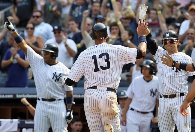 NEW YORK, NY - SEPTEMBER 03:  Alex Rodriguez #13 of the New York Yankees celebrates after scoring a run in the seventh inning against the Toronto Blue Jays with teammate Nick Swisher #33 on September 3, 2011 at Yankee Stadium in the Bronx borough of New Y