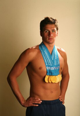 PALO ALTO, CA - AUGUST 03:  Swimmer Ryan Lochte poses with the gold medals he recently won at the 2011 FINA World Championships during a photo shoot on August 3, 2011 at the Crown Plaza Cabana Hotel in Palo Alto, California. Lochte won a total of six meda