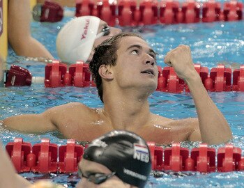 SHANGHAI, CHINA - JULY 31: Nathan Adrian of the United States celebrates winning the gold medal in the Men's 4x100m Medley Relay during Day Sixteen of the 14th FINA World Championships at the Oriental Sports Center on July 31, 2011 in Shanghai, China.  (P