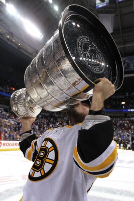 VANCOUVER, BC - JUNE 15:  Brad Marchand #63 of the Boston Bruins kisses the Stanley Cup after defeating the Vancouver Canucks in Game Seven of the 2011 NHL Stanley Cup Final at Rogers Arena on June 15, 2011 in Vancouver, British Columbia, Canada. The Bost