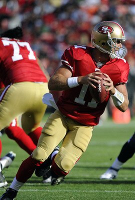 SAN FRANCISCO - AUGUST 27: Alex Smith #11 of the San Francisco 49ers roles out to pass against the Houston Texans during an NFL pre-season football game at Candlestick Park August 27, 2011 in San Francisco, California. (Photo by Thearon W. Henderson/Getty