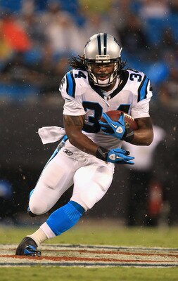 CHARLOTTE, NC - AUGUST 13:  DeAngelo Williams #34 of the Carolina Panthers runs with the ball during their preseason game against the New York Giants at Bank of America Stadium on August 13, 2011 in Charlotte, North Carolina.  (Photo by Streeter Lecka/Get