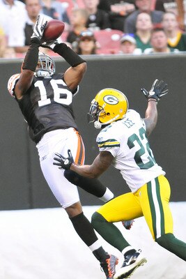 CLEVELAND, OH - AUGUST 13: Josh Cribbs #16 of the Cleveland Browns catches a touchdown pass over Pat Lee #22 of the Green Bay Packers during the first quarter at Cleveland Browns Stadium on August 13, 2011 in Cleveland, Ohio. (Photo by Jason Miller/Getty