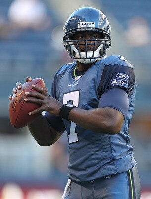 SEATTLE - AUGUST 20:  Quarterback Tarvaris Jackson #7 of the Seattle Seahawks warms up prior to the game against the Minnesota Vikings at CenturyLink Field on August 20, 2011 in Seattle, Washington. The Vikings won 20-7. (Photo by Otto Greule Jr/Getty Ima