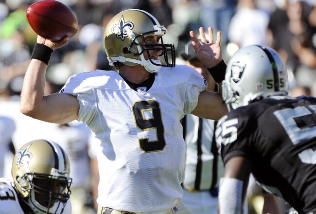 OAKLAND, CA - AUGUST 28:  Drew Brees #9 of the New Orleans Saints throws a pass against the Oakland Raiders in the first quarter during an NFL pre-season football game at the O.co Coliseum August 28, 2011 in Oakland, California. (Photo by Thearon W. Hende