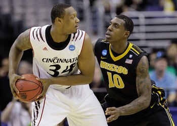 WASHINGTON - MARCH 17:  Ricardo Ratliffe #10 of the Missouri Tigers defends Yancy Gates #34 of the Cincinnati Bearcats during the second round of the 2011 NCAA men's basketball tournament at the Verizon Center on March 17, 2011 in Washington, DC.  (Photo