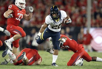 Isi Sofele gets tripped up in Cal's loss to Arizona.