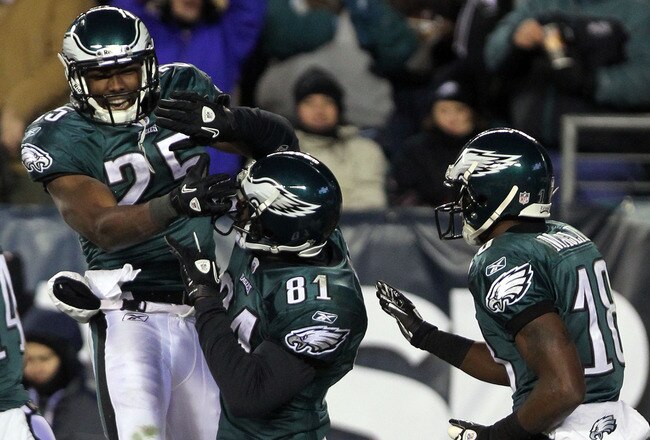 PHILADELPHIA, PA - JANUARY 09:  LeSean McCoy #25, Jason Avant #81 and Jeremy Maclin #18 of the Philadelphia Eagles celebrates Avant's third quarter touchdown against the Green Bay Packers during the 2011 NFC wild card playoff game at Lincoln Financial Fie
