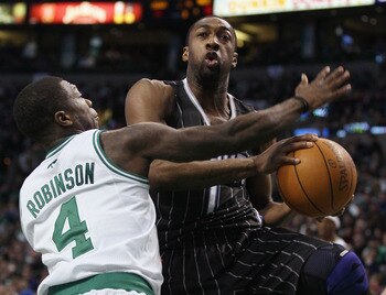 BOSTON, MA - JANUARY 17:   Gilbert Arenas #1 of the Orlando Magic heads for the basket as Nate Robinson #4 of the Boston Celtics defends on January 17, 2011 at the TD Garden in Boston, Massachusetts. The Celtics defeated the Magic 109-106.  NOTE TO USER: